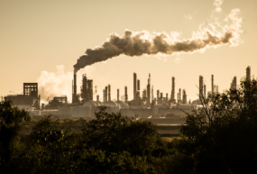 Industrial city with smoke rising